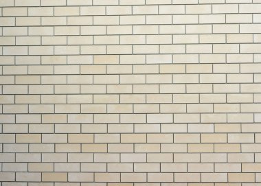 Soyut sarı tuğla duvar, arka plan için desenli. Arkaplan veya tasarım için tuğla duvar deseni, üst görünüm