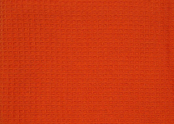 抽象的な背景をシームレスに 天然コットンワッフル生地 布の質感 オレンジキッチンタオルテキスタイルの背景クローズアップ — ストック写真