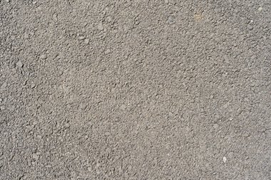 Koyu gri asfalt arkaplan için. Yüzey pürüzsüz asfalt, pürüzsüz asfalt, koyu gri kumlu yol, doku arka planı, üst görünüm