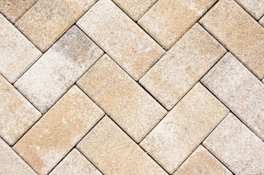 Sokaktaki fayansların ayrıntıları harmonik bir desen oluşturuyor. Tuğla dokusu ve arka plan. Paving levhaları yüzey