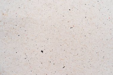 Arka plan olarak bej geri dönüştürülmüş kağıt dokusu. Açık gri ya da bej kağıt ya da karton, yüksek kaliteli çözünürlüklü resim