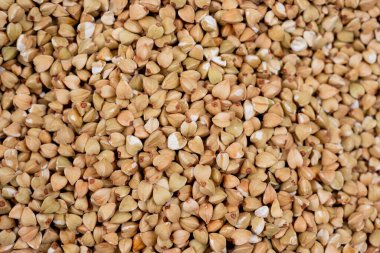 Tedavisi olmayan yeşil karabuğday, yiyecek makro görünümü yakın plan, çiğ yeşil karabuğday arka plan, vegan gıda, arka plan veya tasarım için karabuğday Groats