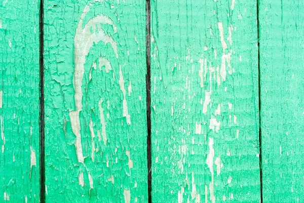 Dirty, stained by a paint the hammered together fence Vintage old wood background surface texture with knot and nail holes