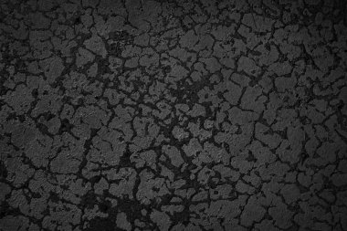 Koyu dokulu ve boyalı bir duvar. Siyah duvar arkaplanı.                                                                                 