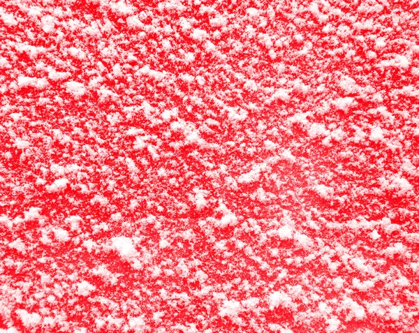 Czerwone tło z śniegu. — Zdjęcie stockowe