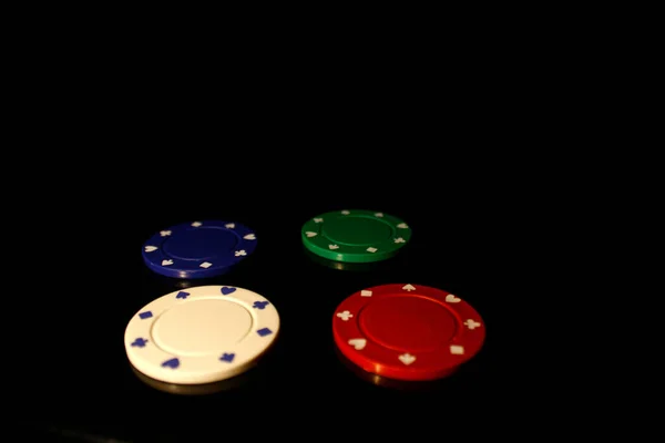 Four Colors Casino Chips Stack White Chip Front Isolated Black — Stock Photo, Image