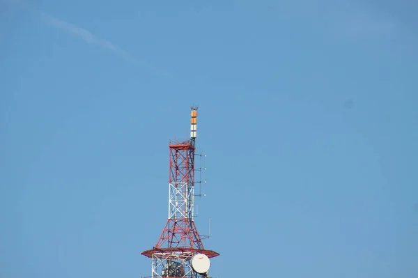 Communication transmission microwave antennae relay on blue sky view of it