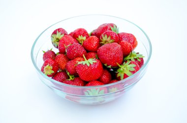 glass bowl with strawberries on a white background