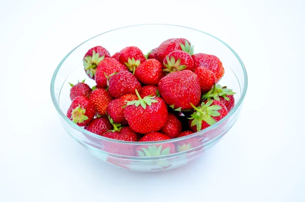 glass bowl with strawberries on a white background