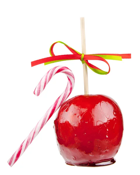 Candied apple with a candy cane — Stock Photo, Image