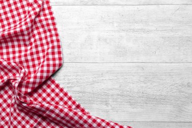 red checkered tablecloth with a wooden background clipart
