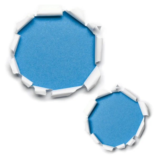 Buracos de papel rasgado azul isolado — Fotografia de Stock