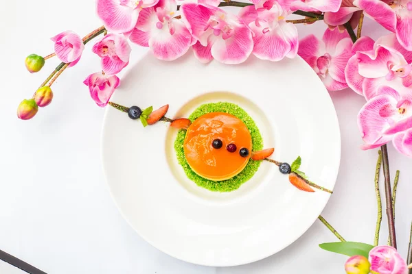 mango cake dish on the table with flowers