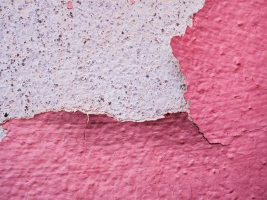 Duvardaki boyayı soymak, arka plandaki grunge dokusu duvardaki alçı.