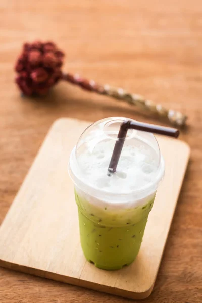 iced green macha tea wooden table