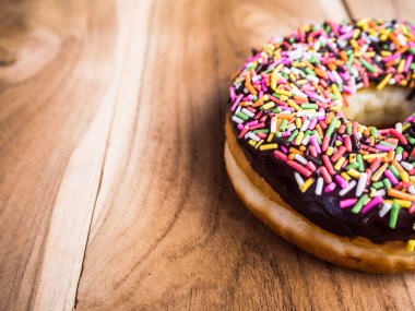 closeup of donut on wooden background 