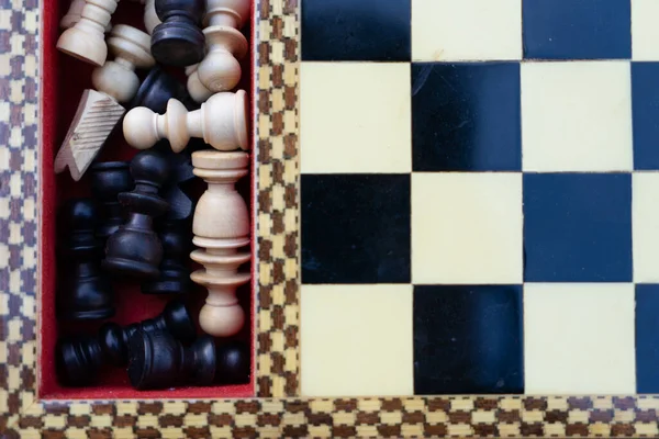 Close-up of chess pieces in the box