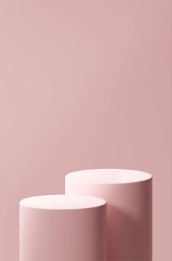 İki ilk şeftali podyumu, iki ilk şeftalili yuvarlak tüp, arka plan olarak ilk şeftali rengi.