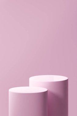 Çift pembe fil kürsüsü, iki pembe fil yuvarlak tüp, arka plan olarak pembe fil rengi.