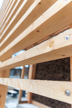 Detail of wooden building construction (graduation tower in Mikolow, Silesia, Poland). Clean, bare wooden design elements.