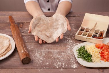 hands chef sculpts pastry for tacos clipart