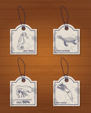 set of 4 vintage design elements seafood: sea horse, turtle, squid and shrimp