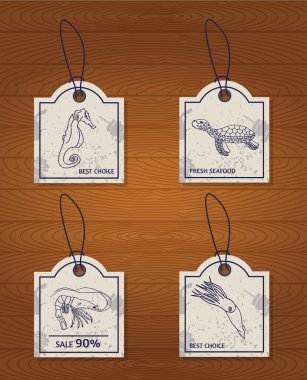 set of 4 vintage design elements seafood: sea horse, turtle, squid and shrimp clipart