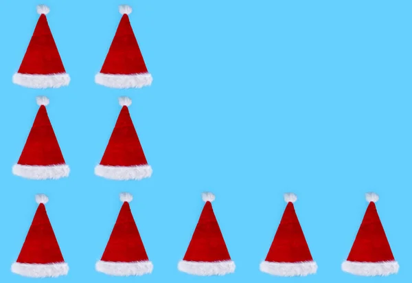Santa Claus Hats Empty Space Text Blue Background — Stock Photo, Image