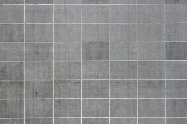 Taş desenli gri blok panel arka planı, modern bina cephesi