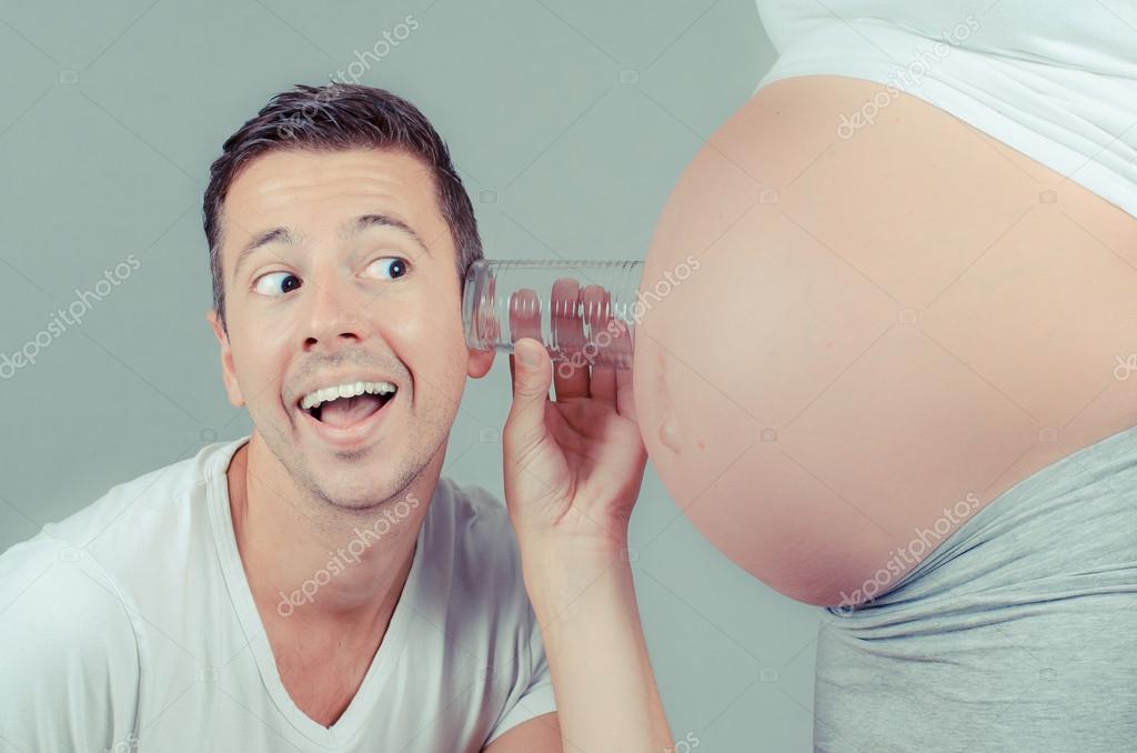 Funny father listening with a glass on the belly of his pregnant wife Stock Photo by ©nielshariot 74942501 Funny father listening with a glass on the belly of his pregnant wife Stock Photo by ©nielshariot 74942501