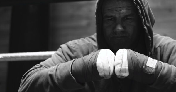 Fighting preparation. Cropped shot of a ripped fighter wrapping 