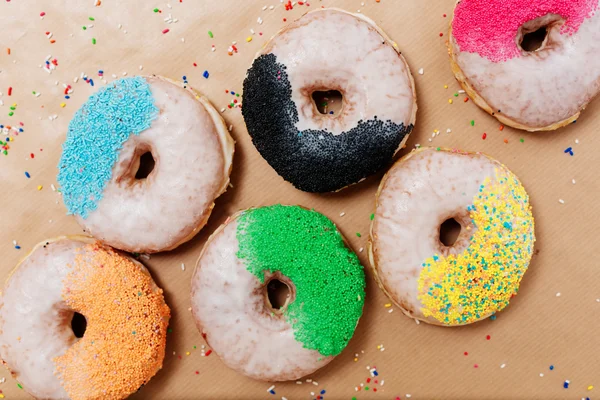 Colorful donuts on paper  background — Stock Photo, Image