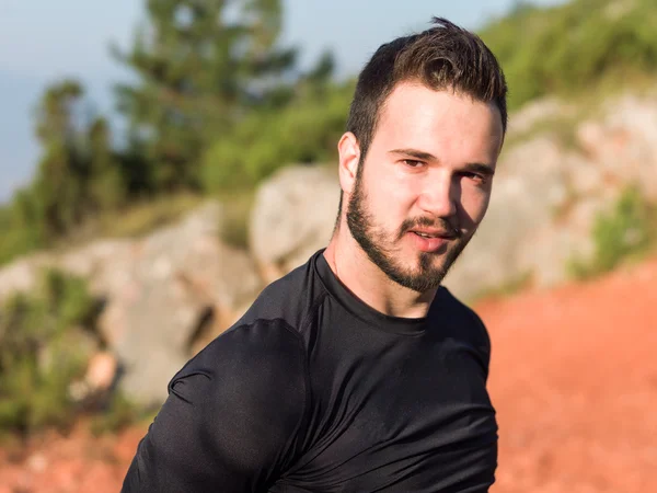 Athlete male runner running on mountain road. Running man joggin — Stock Photo, Image