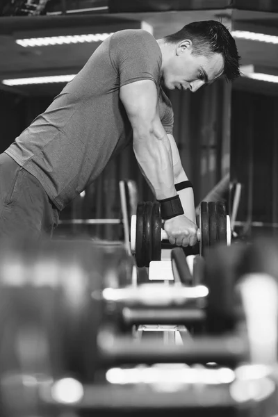 Young Man Working Out Biceps - Dumbbell Concentration Curls — Stock Photo, Image