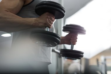 Closeup of a muscular young man lifting weights, Caucasian man clipart