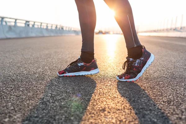fitness sunrise jog workout welness concept. Runner feet running