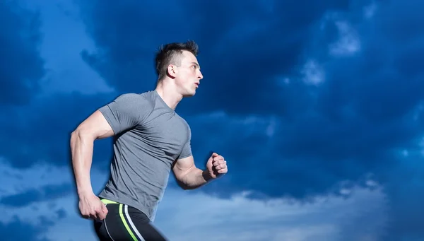 Healthy man jogging in the city at early morning in night — Stock Photo, Image