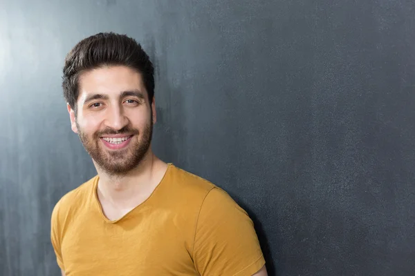 Smiling casual man close up portrait against dark background. — Stock Photo, Image