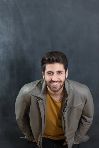 Portrait of a bearded man on chalkboard background — Stock Photo, Image