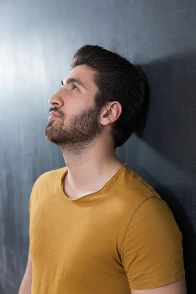 Handsome young man smiling on black background. Studio shot. — Stock Photo, Image