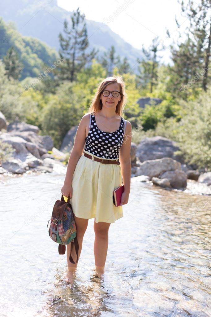 Young woman with book in hands