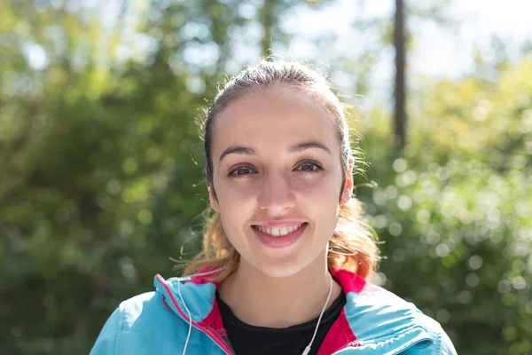 Closeup of a female runner smiling — Stock Photo, Image