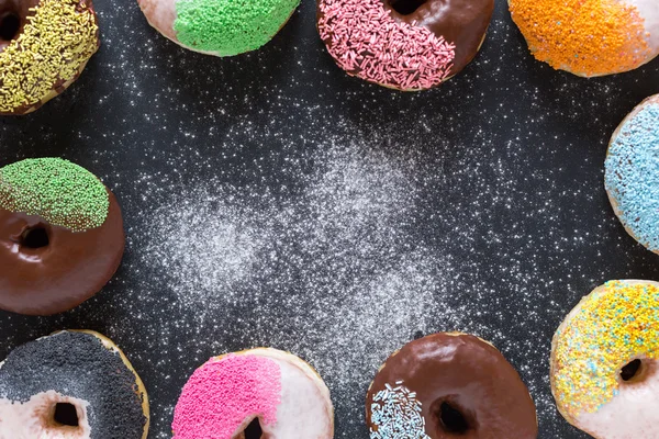 Assorted donuts with powder — Stock Photo, Image