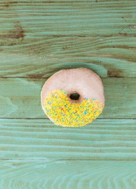 fresh donut on wooden table   clipart