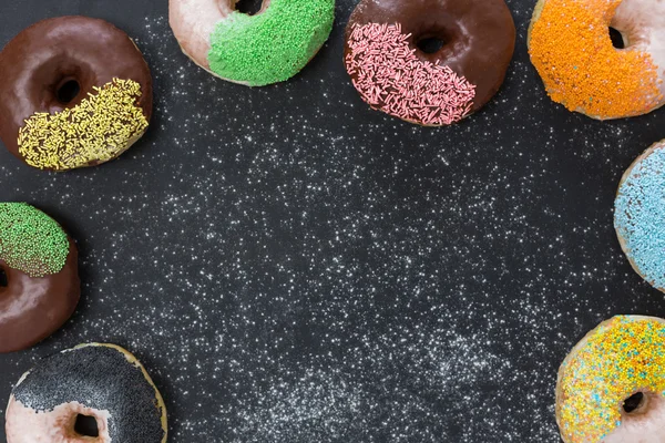 Assorted donuts with powder — Stock Photo, Image