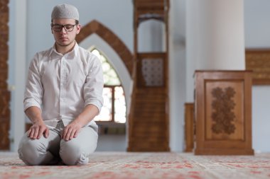 Muslim Man Is Praying In The Mosque clipart