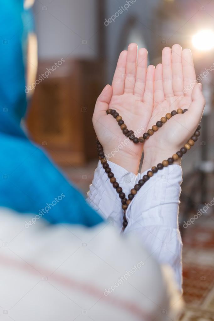 Muslim girl praying Stock Photo by ©Myvisuals 118351848