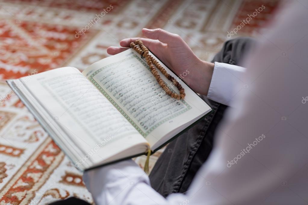 Muslim Man Reading Quran Stock Photo by ©Myvisuals 118356492