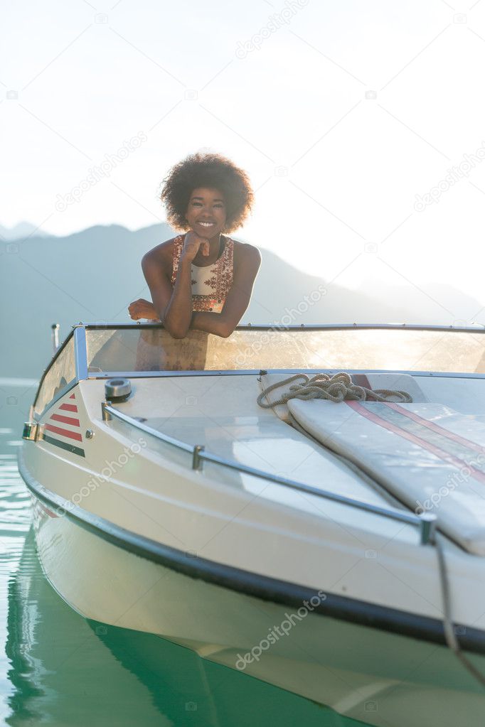 afro woman on a motor boat 