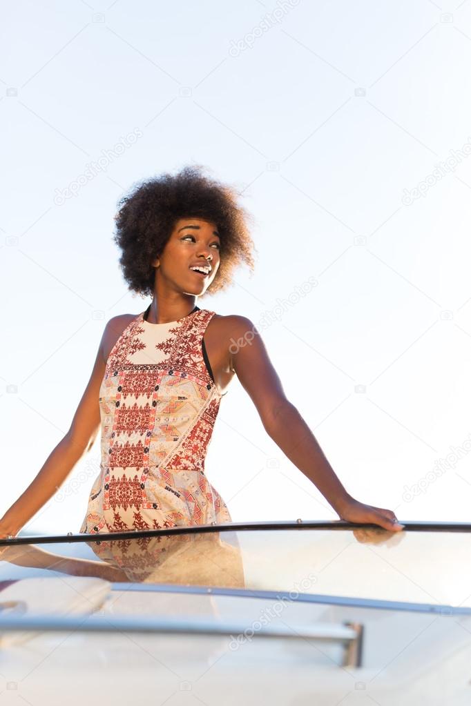 afro american woman on private yacht